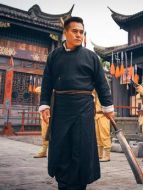 楊報國（黑子飾演）
